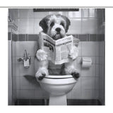 A fluffy dog sits on a toilet seat holding a newspaper in a tiled bathroom, with a Balck and White Funny Read Book Dog Shower Curtain-Cottoncat by Cotton Cat behind it and a toilet paper roll on the wall.
