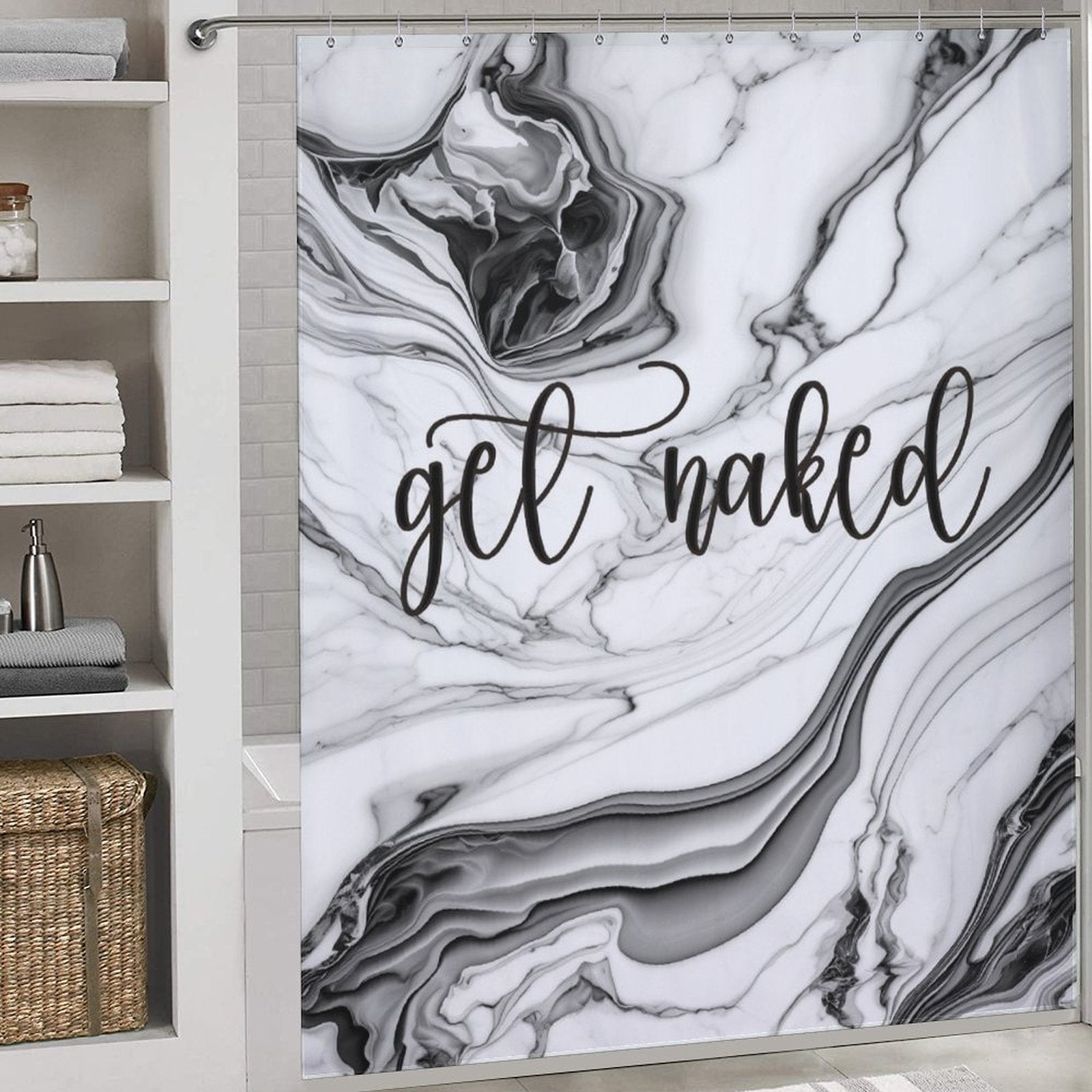 Bathroom with a black and white marble-themed shower curtain bearing the Funny Letters Black and White Marble Get Naked Shower Curtain-Cottoncat in cursive script. A shelving unit on the left holds white towels and woven baskets.