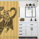 A bathroom with white cabinets, dual sinks, black fixtures, and a patterned floor is shown. The bathroom decor includes a Cotton Cat Funny Cool Mouse Riding Cat Shower Curtain featuring an illustration of a mouse riding a cat, both wearing clothing and holding swords.