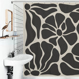 Bathroom with a Vintage Boho Flower Black and Grey Art 70s Black Floral Mid Century Abstract Shower Curtain-Cottoncat by Cotton Cat, a white sink, a wall-mounted mirror, and a bird-shaped statuette on a shelf.