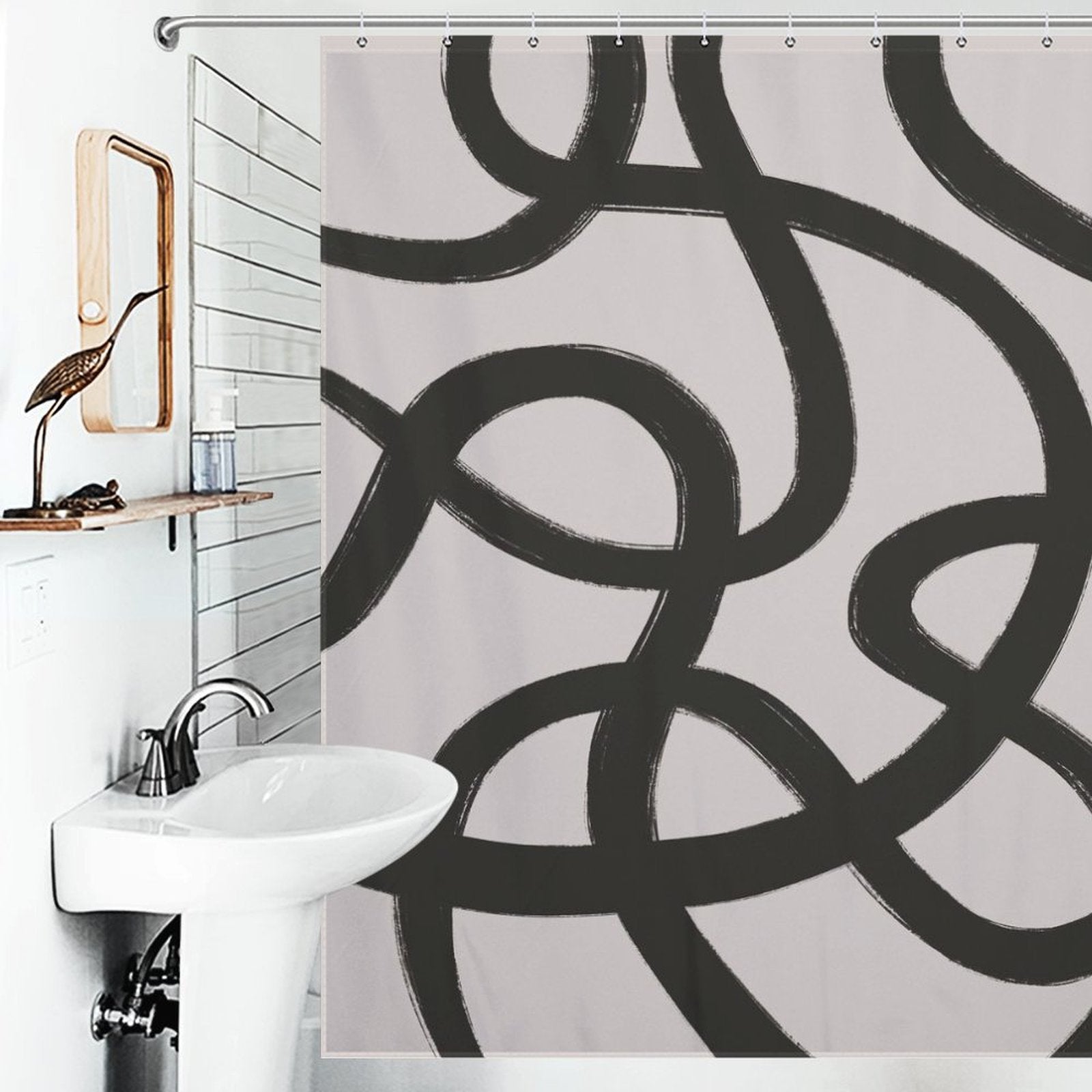 A bathroom with a white sink and a mirror on the wall features the Cotton Cat Modern Geometric Art Minimalist Curve Black Line Black and Grey Abstract Shower Curtain-Cottoncat, adding a touch of modern geometric art.