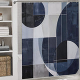 A bathroom featuring a Cotton Cat Geometric Deep Blue Abstract Art Mid-Century Modern Style Shower Curtain-Cottoncat in shades of blue and white. Shelves with folded towels and a woven basket are visible on the left side, adding to the mid-century modern style.