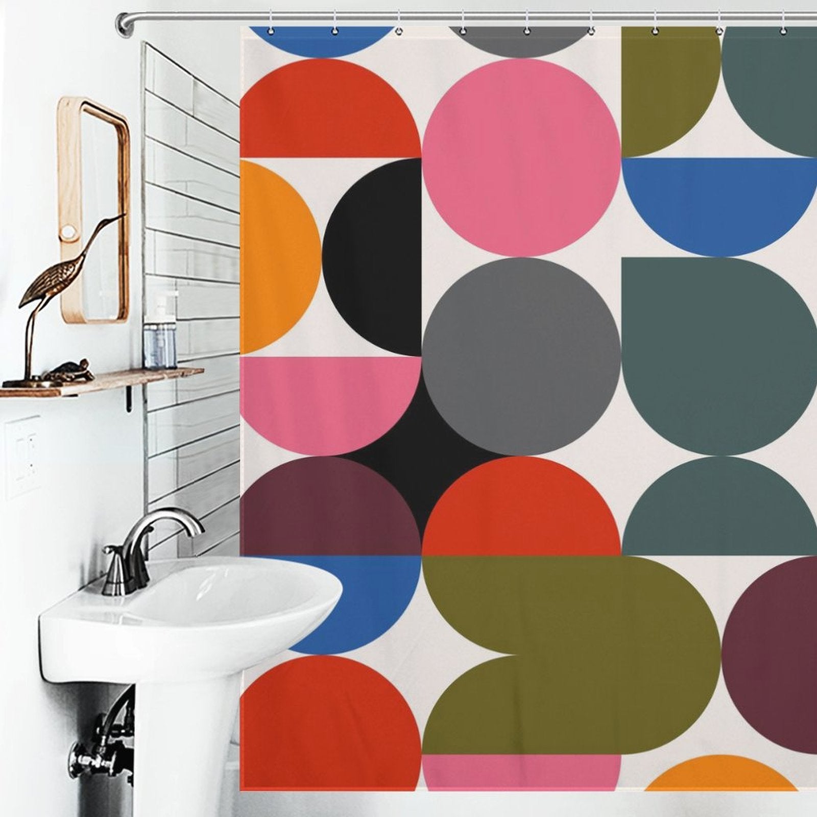 A bathroom featuring a white sink and a Cotton Cat Abstract Modern Art Rainbow Polka Dot Geometric Shower Curtain-Cottoncat with bold, abstract modern art in various colors including red, pink, black, gray, green, blue, and orange shapes.