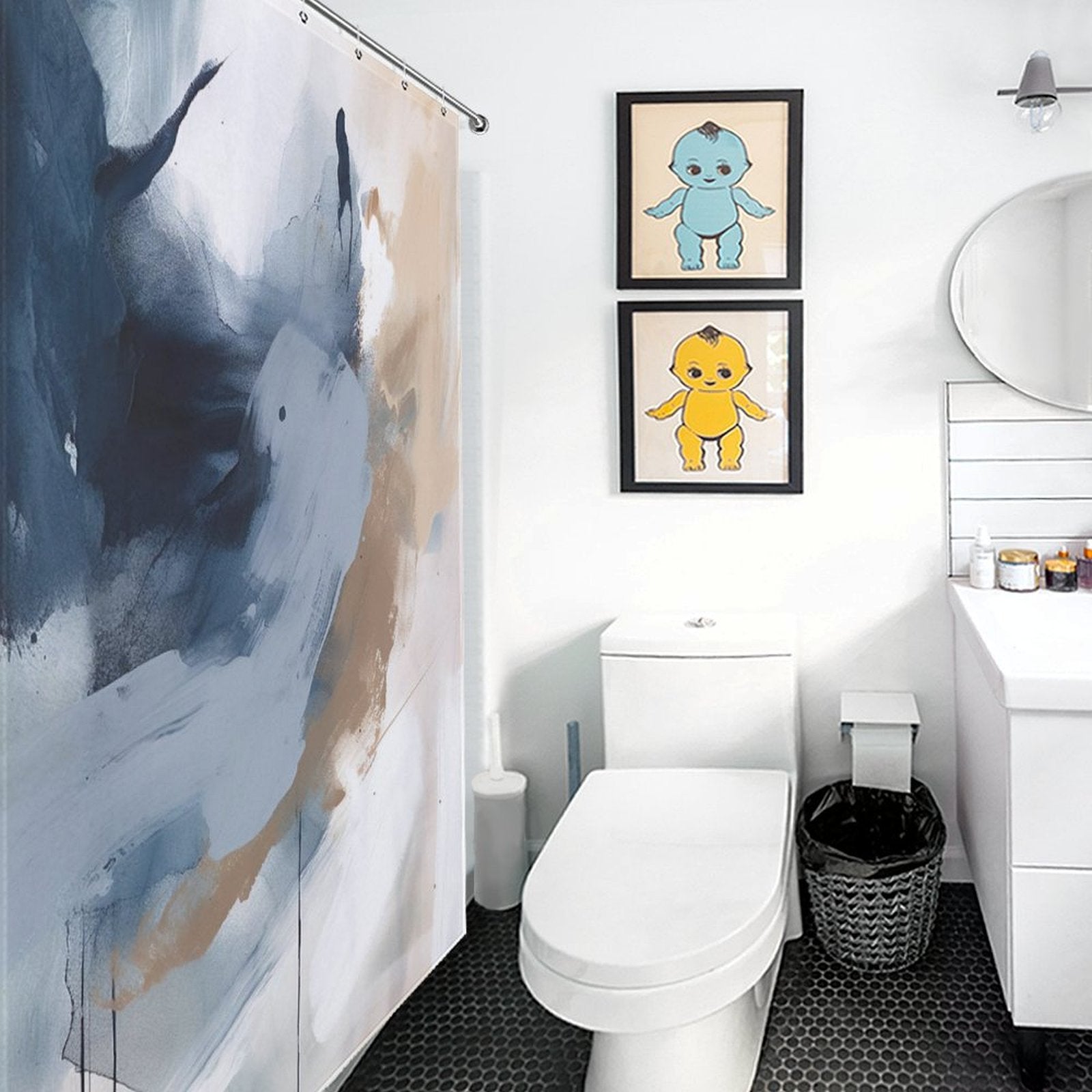 A bathroom with a white toilet, sink, Modern Wall Art Oil Painting Navy Blue Abstract Shower Curtain-Cottoncat by Cotton Cat, and two framed pictures of cartoon characters on the wall.