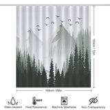 A Cotton Cat Green Misty Forest Shower Curtain Ombre Sage Green White Nature Tree Mountain Woodland-Cottoncat featuring a misty forest and mountain design with flying birds, perfect for bathroom decor. Dimensions: 168 cm x 183 cm. Icons indicating water-resistant, heat resistance, machine washable, and non-transparency.