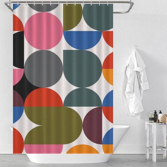 A white bathroom with a Cotton Cat Abstract Modern Art Rainbow Polka Dot Geometric Shower Curtain-Cottoncat. A white robe hangs on the wall, and toiletries are neatly arranged on a tray beside the bathtub.