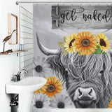 A bathroom features a Highland Cow Black and White Funny Letters Sunflower Get Naked Shower Curtain-Cottoncat by Cotton Cat displaying a highland cow adorned with a sunflower crown, with the whimsical phrase "get naked" at the top.