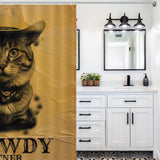 A bathroom with white cabinets, a black countertop, and a large mirror is adorned with a Funny Cowboy Cool Meowdy Partner Cat Shower Curtain-Cottoncat from Cotton Cat.