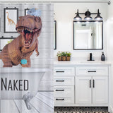 A bathroom with a white vanity and wall mirror is complemented by a Funny Dinosaur Get Naked Shower Curtain-Cottoncat featuring a T-Rex wearing a shower cap standing in a bathtub with the words "GET NAKED" printed on it. This unique bathroom decor adds a playful touch to your space.