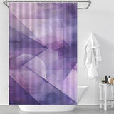 Bathroom with a white tub, a Cotton Cat Purple Abstract Modern Boho Geometric Art Minimalist Shower Curtain featuring modern boho geometric art, and a white bathrobe hanging on the wall. A small shelf with toiletries is placed beside the tub, completing the minimalist bathroom decor.
