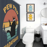Bathroom with white walls and fixtures featuring a Funny Black Crazy Cat with Gun Shower Curtain-Cottoncat by Cotton Cat and two framed baby character prints on the wall.
