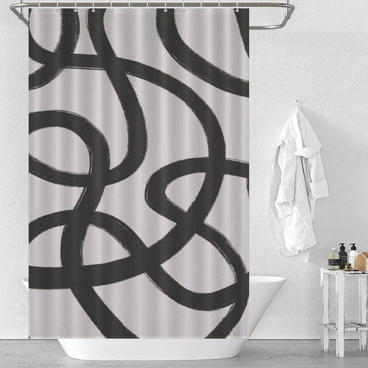 A bathroom with a white tub and a Modern Geometric Art Minimalist Curve Black Line Black and Grey Abstract Shower Curtain-Cottoncat by Cotton Cat. Towels hang on the wall, and various toiletries rest on a small white table.