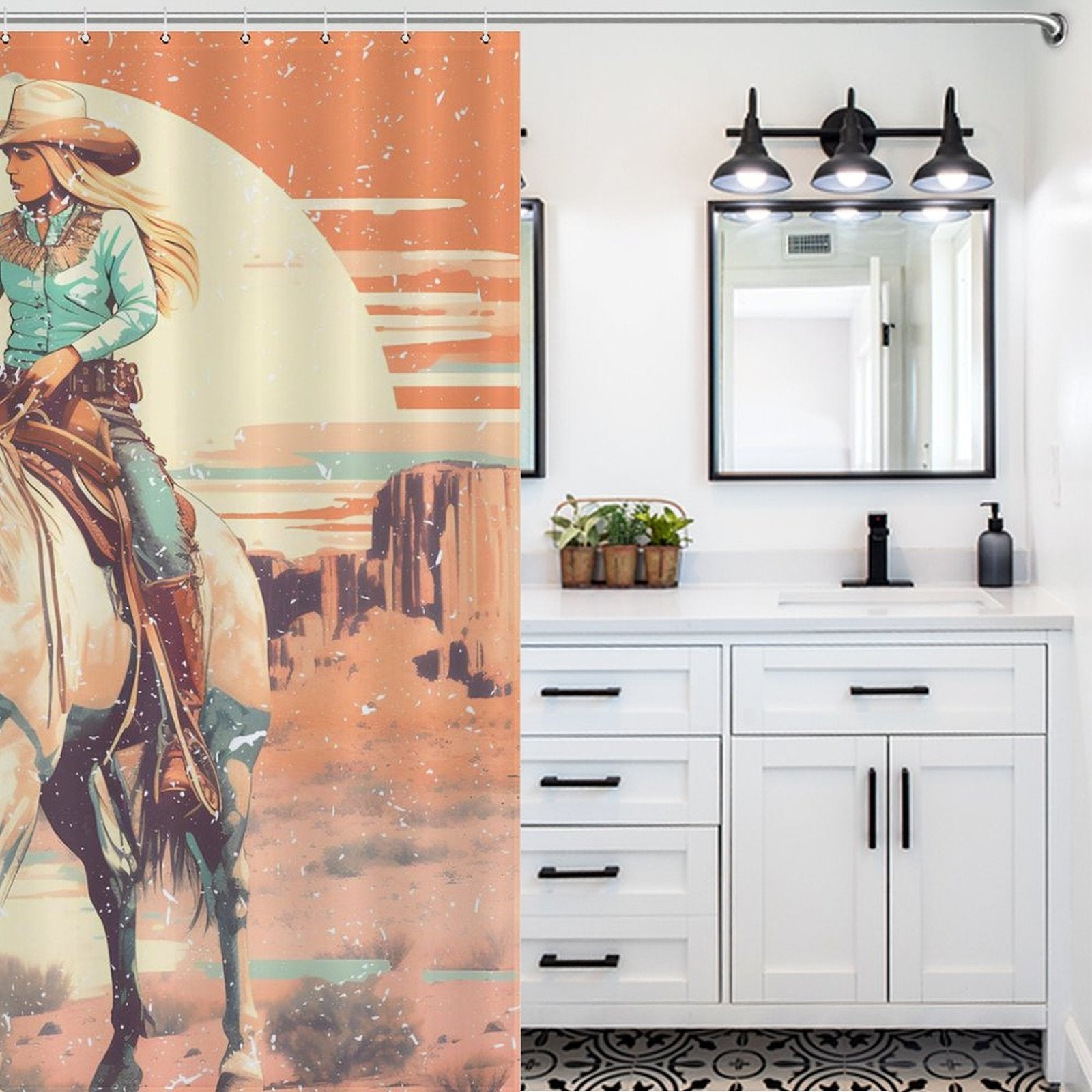 Bathroom with white cabinetry and black hardware, a large mirror with lights above, and a Cotton Cat Rustic Sunrise Western Cowgirl Shower Curtain depicting a person on horseback in a western landscape.