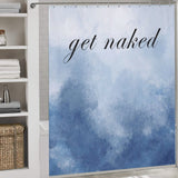 Shower curtain with a blue watercolor design and the phrase "get naked" in black cursive text, hanging in a bathroom with shelves and a woven basket. This Funny Letters Abstract Blue Get Naked Shower Curtain-Cottoncat by Cotton Cat adds a playful touch to your décor.