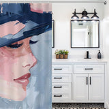Bathroom with a Mid Century Women Face Abstract Aesthetic Oil Painting Modern Art Blush Pink Navy Blue Cream Shower Curtain-Cottoncat by Cotton Cat, white vanity cabinets with black handles, potted plants, and a three-light fixture above a rectangular mirror.