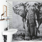 Monochrome bathroom with a sink and a mirror; the elegant Cotton Cat Black and White Elephant Shower Curtain-Cottoncat features a detailed black and white image of an elephant, adding sophistication to the bathroom decor.