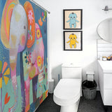 A brightly colored children's bathroom with a whimsical Cute Baby Cartoon Elephant Shower Curtain-Cottoncat by Cotton Cat, black-and-white flooring, framed animal art, a white toilet, a sink, a round mirror, and a black trash can.