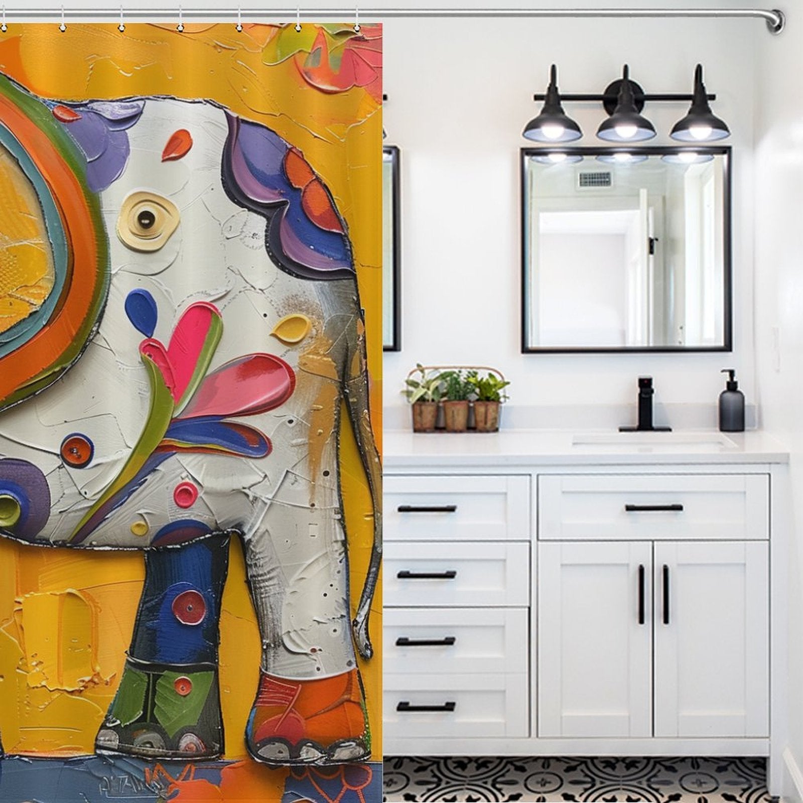 Bright, colorful baby elephant design shower curtain beside a white bathroom vanity with black fixtures, under a three-light vanity fixture and a rectangular mirror. This Cute Baby Elephant Shower Curtain-Cottoncat by Cotton Cat adds an adorable touch to your bathroom decor.