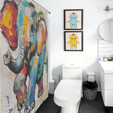 Bathroom featuring a Cute Painting Happy Elephant Shower Curtain-Cottoncat by Cotton Cat, white fixtures, a round mirror, and framed blue and yellow character art on the wall.