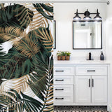 A bathroom with a waterproof Tropical Leaves Jungle Shower Curtain by Cotton Cat as part of the decor.
