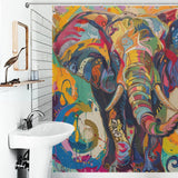 A bathroom with a white sink and wooden mirror features a vibrant, multi-colored Cotton Cat Multi Colored Happy Elephant Shower Curtain-Cottoncat showcasing a happy elephant design as part of the lively bathroom decor.
