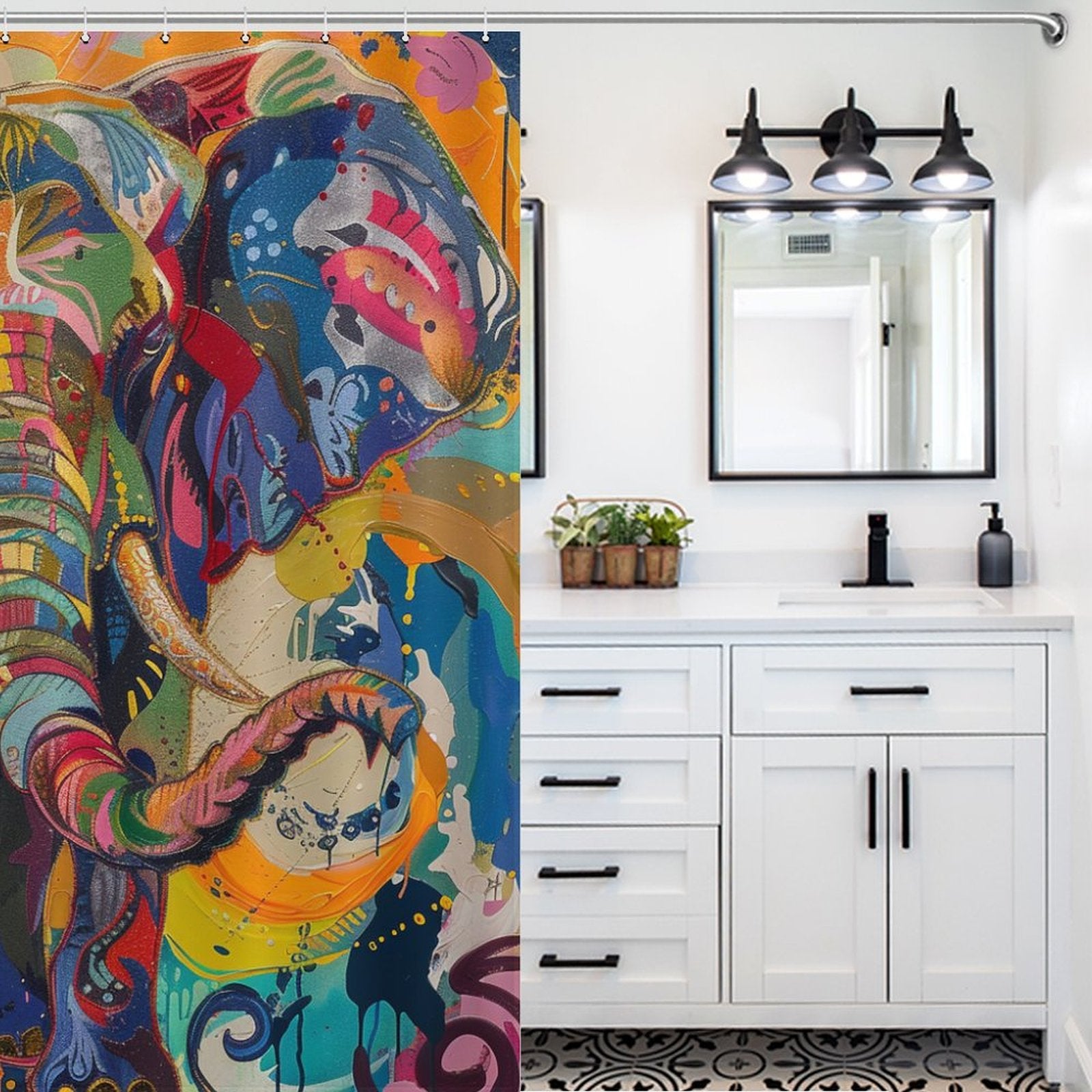 A bathroom with white cabinets, black fixtures, and a vibrant Cotton Cat Multi Colored Happy Elephant Shower Curtain-Cottoncat. There is a mirror above the sink and a light fixture with three bulbs, enhancing the cheerful bathroom decor.