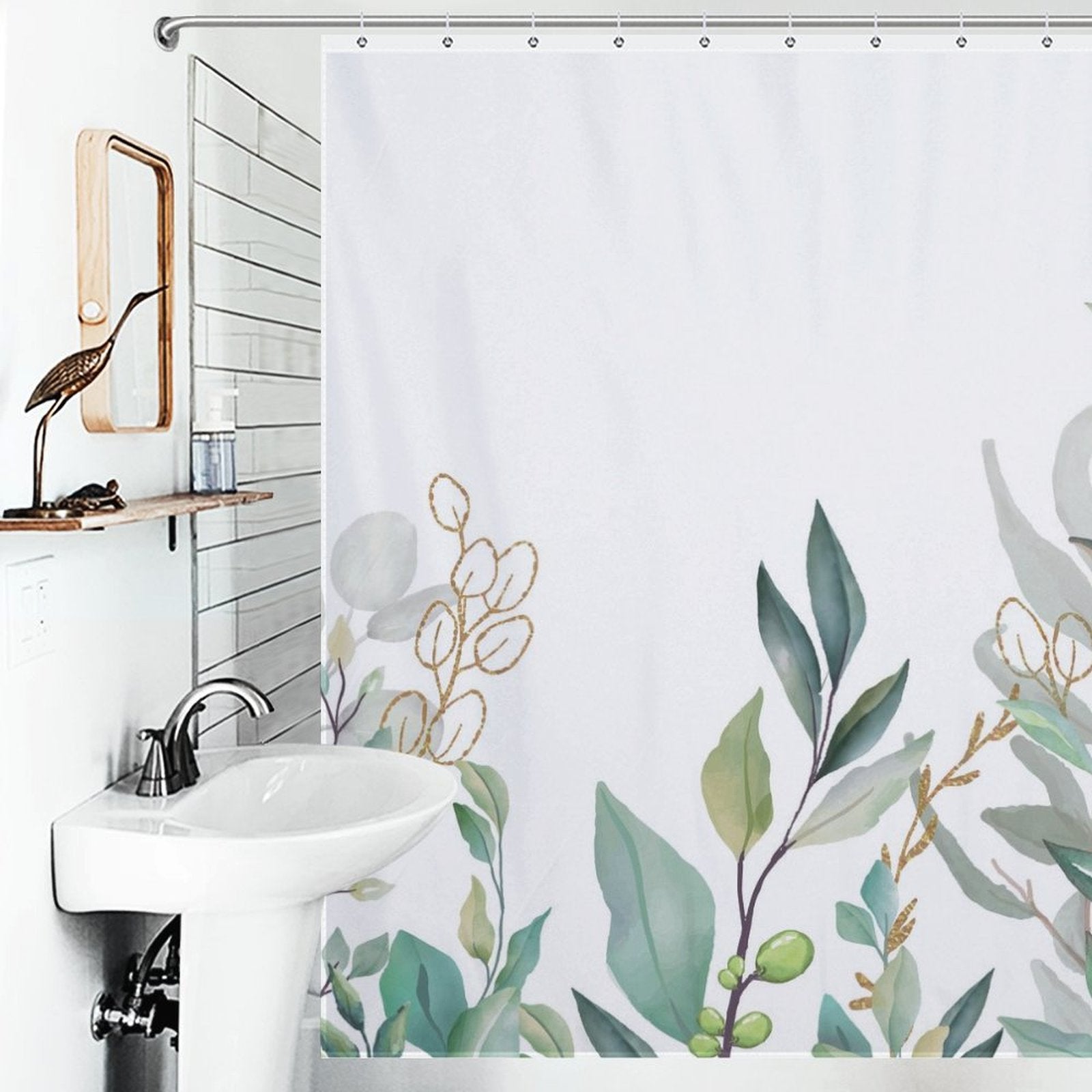 A bathroom with a white sink, a wooden-framed mirror, and a Watercolor Sage Green Eucalyptus Botanical Leaves Shower Curtain-Cottoncat adorned with watercolor sage green eucalyptus designs by Cotton Cat.