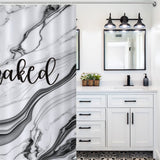A bathroom with white cabinetry, a Funny Letters Black and White Marble Get Naked Shower Curtain-Cottoncat by Cotton Cat, a dark faucet, a potted plant, a mirrored cabinet, and three black light fixtures.