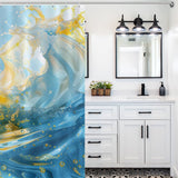 A bathroom with white cabinets, a black-framed mirror, and a light fixture above. The space features vibrant yellow and blue bathroom decor, including the Abstract Yellow and Blue Wave Ocean Watercolor Shower Curtain-Cottoncat from Cotton Cat that adds an artistic touch with its swirling patterns.
