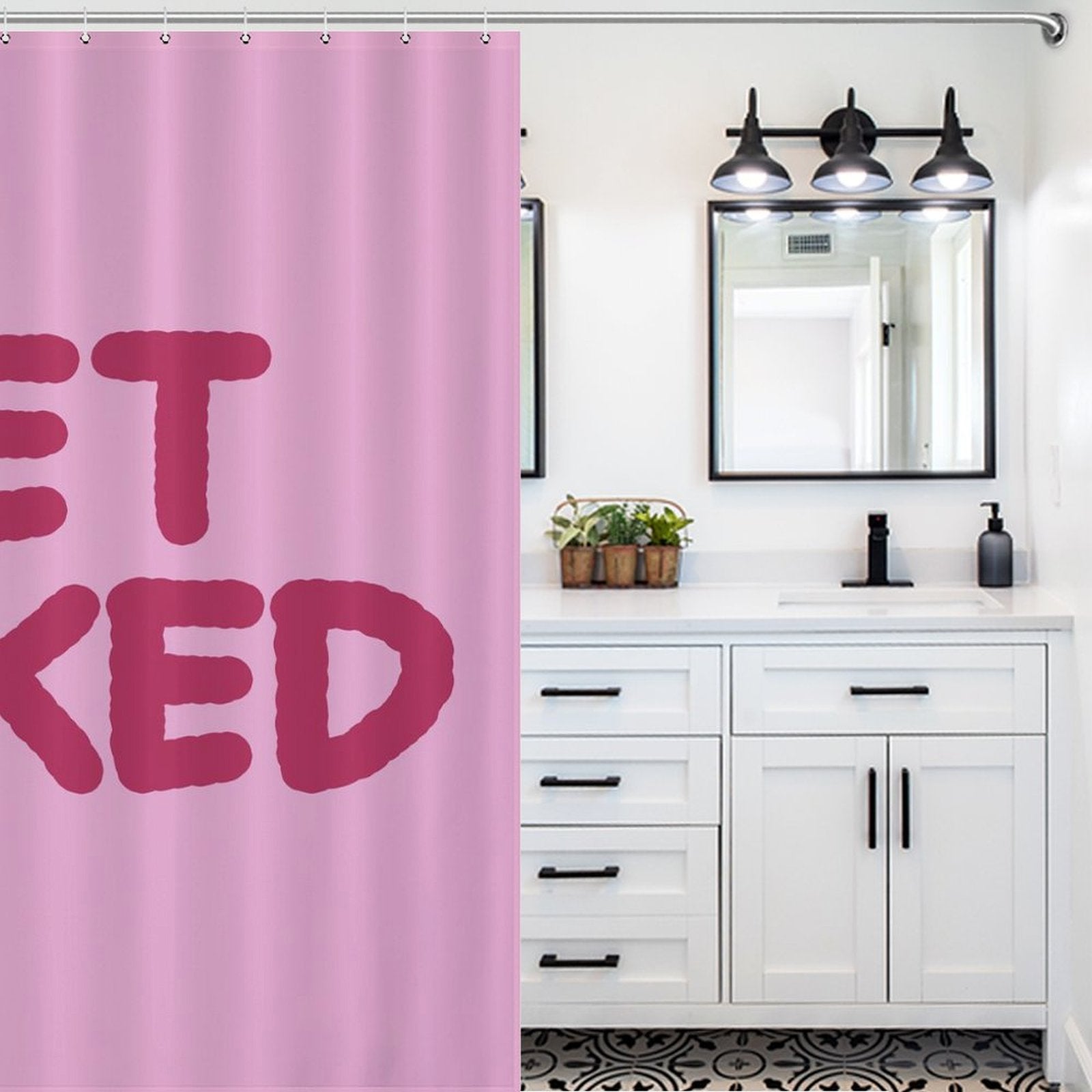 A bathroom with a white vanity, black hardware, dual mirrors, and a Simple Funny Letters Pink Get Naked Shower Curtain-Cottoncat by Cotton Cat featuring funny black and white letters adds a touch of playful bathroom decor.