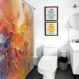 A bathroom with a Cotton Cat Burnt Orange Abstract Oil Painting Modern Art Yellow Blue Brushstrokes Shower Curtain-Cottoncat featuring vibrant abstract patterns, two framed pictures of turtle-like characters above the toilet, a round mirror above the sink, and black hexagonal floor tiles.