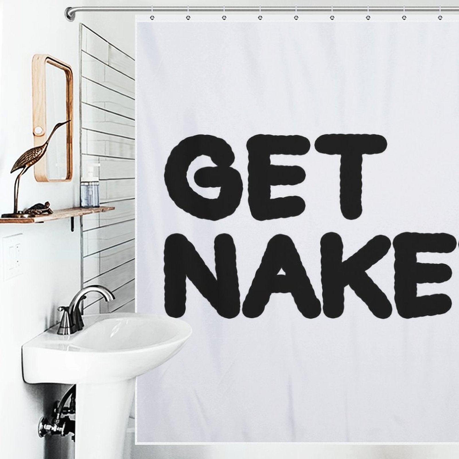 A bathroom with a white sink, a wooden mirror, and a Funny Letters Black and White Get Naked Shower Curtain-Cottoncat with the bold text: 'GET NAKED'.