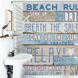 A beach-themed bathroom with a Beach Rules Anchor Shower Curtain-Cottoncat.