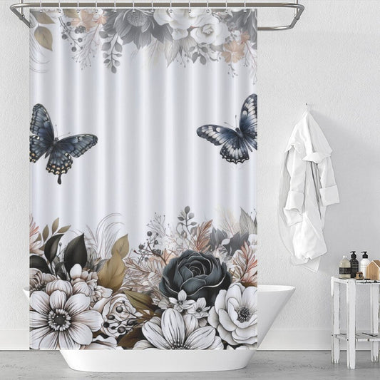 A white bathroom features a Black White Butterfly Leaf Floral Shower Curtain-Cottoncat by Cotton Cat in black, white, and gray tones. The waterproof fabric ensures durability. A white towel hangs on the wall next to the bathtub, and toiletries are placed on the tub's edge.