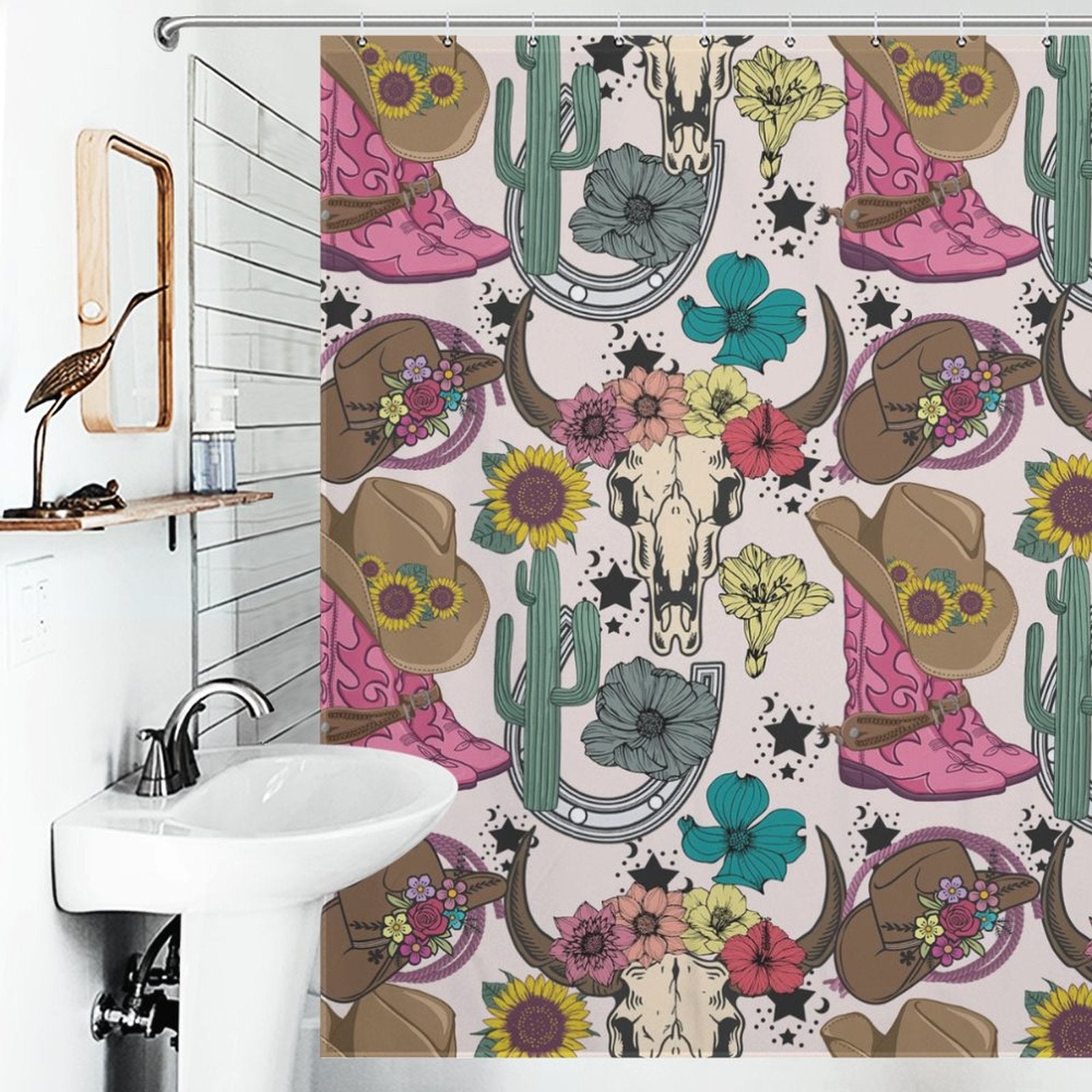 Decorative bathroom with a rustic vintage farmhouse vibe, featuring a "Boots Cactus Bull Skull Sunflower Rustic Vintage Farmhouse Western Shower Curtain-Cottoncat" by Cotton Cat adorned with cow skulls, cacti, cowboy boots, horseshoes, hats, sunflowers, and floral patterns. White sink with a mirror frame to the left.