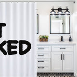 A white bathroom with black and white decor, a double sink, mirrors, black fixtures, and a Funny Letters Black and White Get Naked Shower Curtain-Cottoncat with funny letters reading "GET NAKED" in large black print by Cotton Cat.