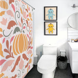 A bathroom featuring a white toilet, a sink with a mirror, a wastebasket, a Boho Fall Pumpkins Pink Floral Shower Curtain-Cottoncat adding vibrancy, and two framed cartoon prints on the wall.