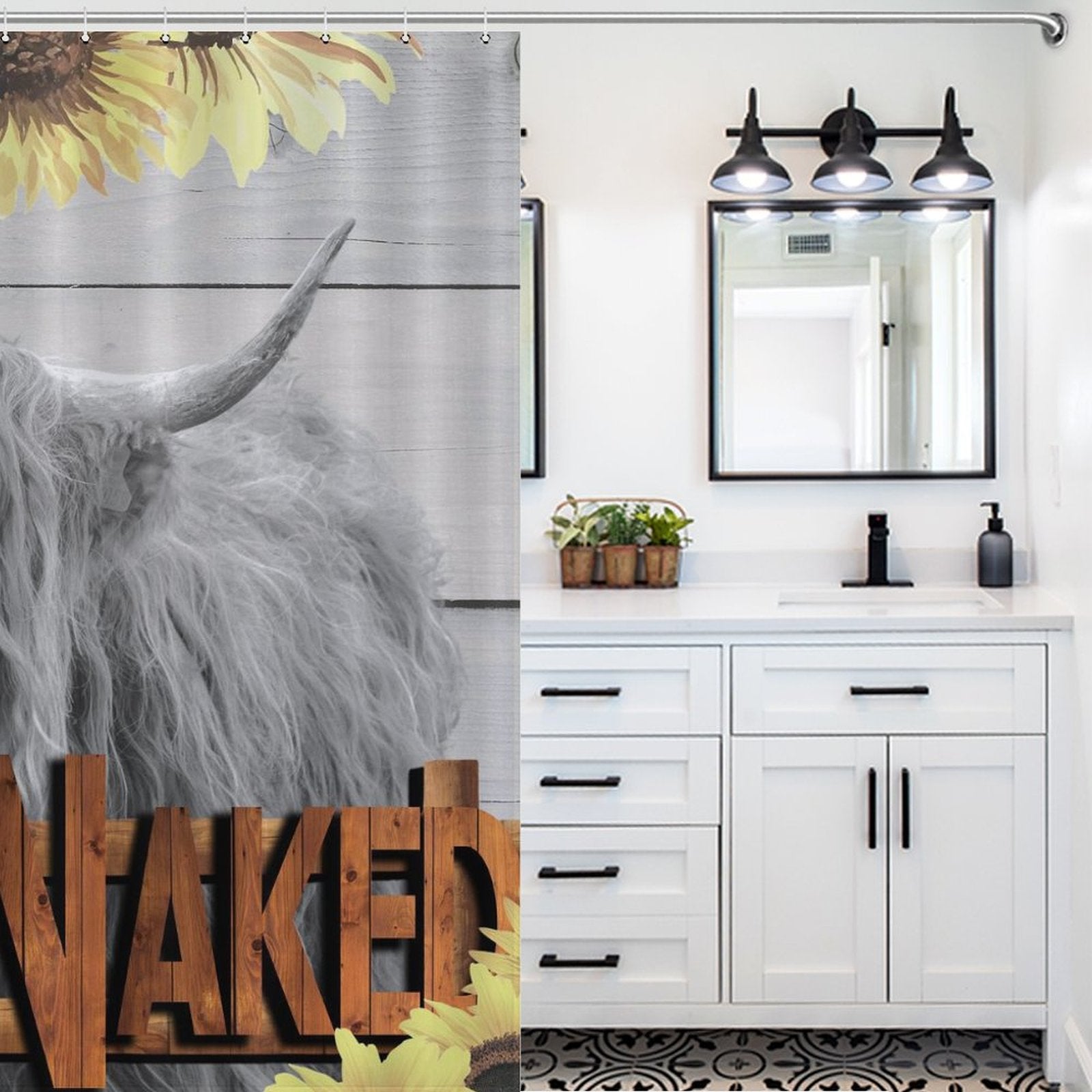 A bathroom with a white vanity, black fixtures, a potted plant, and a rustic touch featuring a Highland Cow Sunflowers Get Naked Shower Curtain-Cottoncat with the word "NUKED" partially obscured on it. Produced by Cotton Cat.