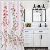 Bathroom with a Rustic Spring Blossom Pink Floral Shower Curtain-Cottoncat by Cotton Cat, a white vanity with black handles, a rectangular mirror, and three overhead lights.