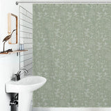 A bathroom featuring a white sink, a wall-mounted mirror, and a Boho Retro Sage Green Herbs Flower Shower Curtain-Cottoncat by Cotton Cat with a green floral pattern.