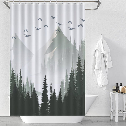 The Cotton Cat Green Misty Forest Shower Curtain Ombre Sage Green White Nature Tree Mountain Woodland-Cottoncat with a scenic mountain and forest design, featuring flying birds, hanging in a bathroom with a white bathtub, white towel, and various toiletries. This ombre sage green design elevates the space while its waterproof mildew-resistant material ensures lasting durability.