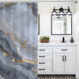 A modern bathroom featuring a white vanity with black handles, a mirror with a black frame, overhead lighting, and a luxurious Cotton Cat Gray Gold Stripe Abstract Marble Texture Art Shower Curtain-Cottoncat.