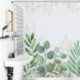 A bathroom with a white sink, mirror, and a Natural Modern Ombre Sage Green White Leaf Shower Curtain-Cottoncat featuring light green leafy plants by Cotton Cat.