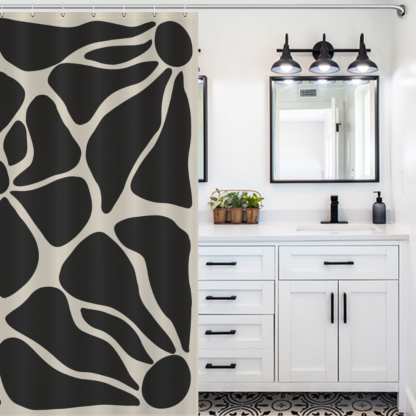 A bathroom with a white vanity, double mirrors, and a patterned floor. The Cotton Cat Vintage Boho Flower Black and Grey Art 70s Black Floral Mid Century Abstract Shower Curtain-Cottoncat boasts an elegant black-and-white design, tying together the stylish space.