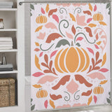 A Boho Fall Pumpkins Pink Floral Shower Curtain-Cottoncat by Cotton Cat with a pumpkin-themed design in orange, pink, and green hues adds charm. Shelves with folded towels and a wicker basket are visible on the left side.