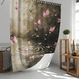 A Pink Butterfly Flying over Forest Water Shower Curtain by Cotton Cat, featuring an artistic design of butterflies near a rippling pond, is hung in a modern bathroom with white walls and natural light. A wicker basket and wooden shelf add to the nature bathroom decor, creating a serene oasis.