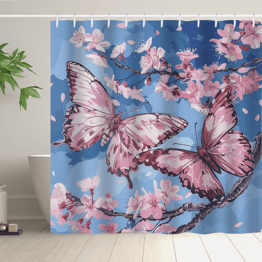 The Cotton Cat Aesthetic Blue Sky Pink Butterfly Floral Shower Curtain boasts a stunning design with two large butterflies and cherry blossoms set against a tranquil blue background. A potted plant placed beside the bathtub enhances this beautiful piece of nature-inspired art.