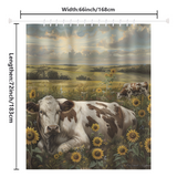 The Farmhouse Cow Graze Sunflower Shower Curtain by Cotton Cat showcases two cows lounging in a sunflower field beneath a cloudy sky. The curtain measures 66 inches in width and 72 inches in length.