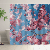 A Blue Sky Painting Pink Butterfly Floral Shower Curtain-Cottoncat by Cotton Cat, featuring cherry blossoms against a blue background, hangs in a bathroom next to a white tub and a green potted plant, adding an elegant touch with its water-resistant fabric.