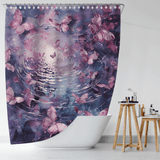 The Cotton Cat Pink Butterfly Flying over Water Shower Curtain features delicate butterflies gliding over a rippling water surface in a serene purple and blue-toned scene. Made from water-resistant fabric, it looks enchanting when hung over a white bathtub and pairs beautifully with nearby shelves filled with toiletries and a small plant, enhancing the bathroom's charming decor.